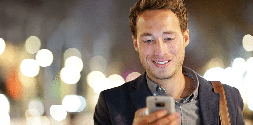 happy man using smartphone