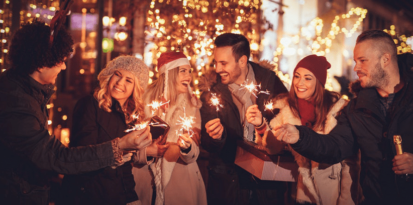 happy friends gathering during christmas