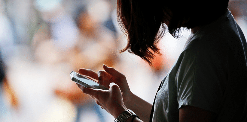 woman using her smartphone