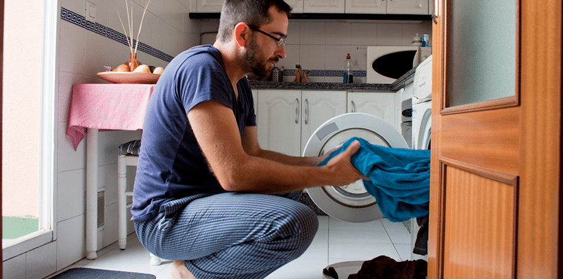 man doing laundry