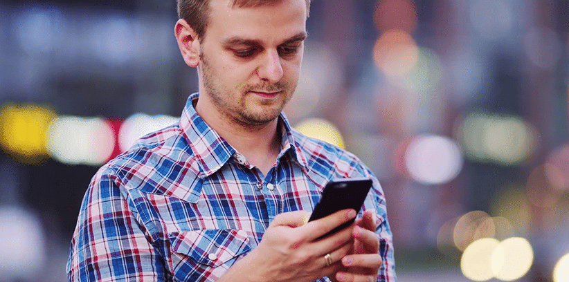 man using his smartphone