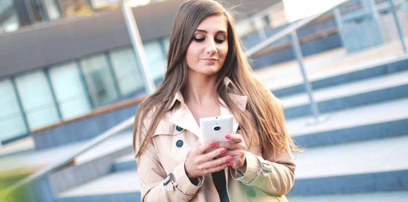 woman chatting with someone using smartphone