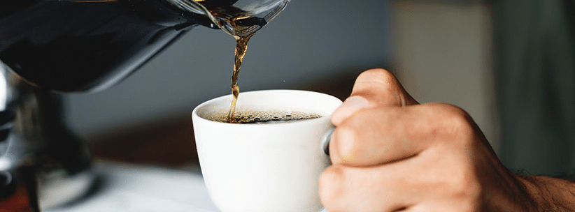 pouring coffee into the cup