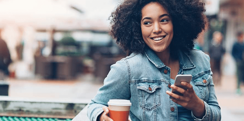 happy woman chatting using smartphone