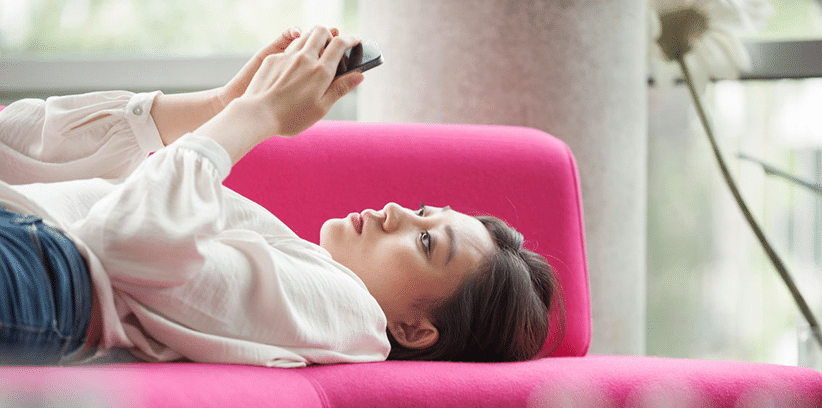 woman browsing in her smartphone