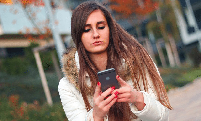 woman browsing internet via smartphone