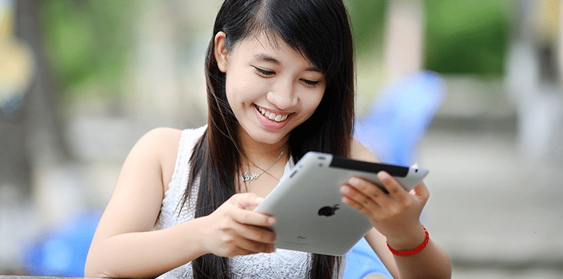 woman browsing via her tablet