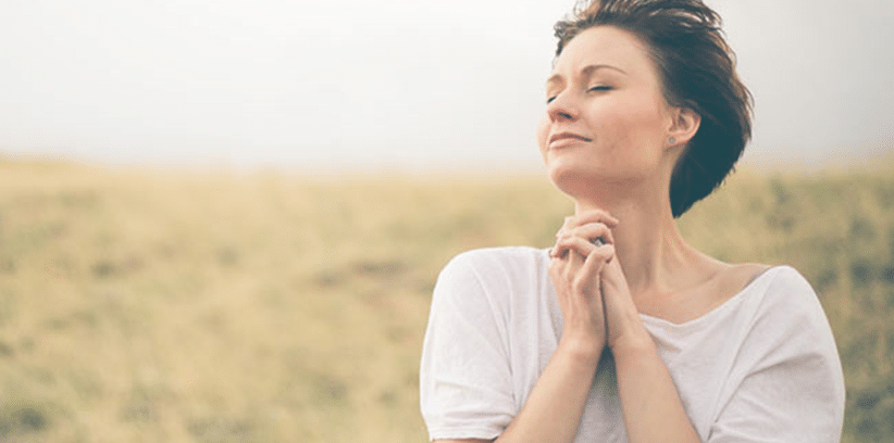 happy woman praying