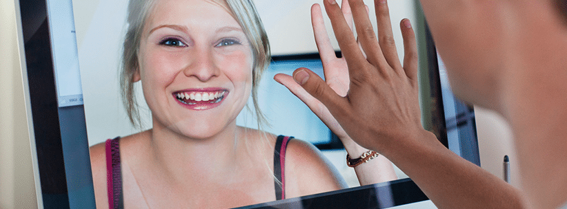 happy woman chatting her long distance partner