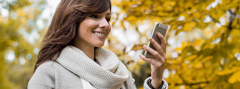 happy woman chatting via dating app