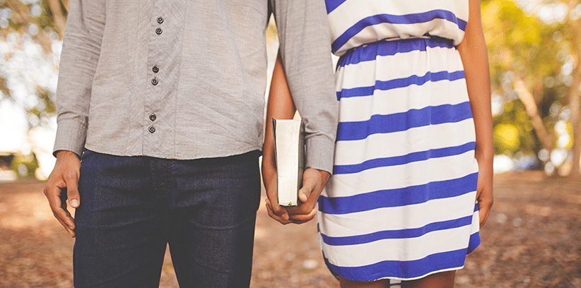 couple holding the Bible