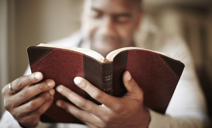 man reading the bible