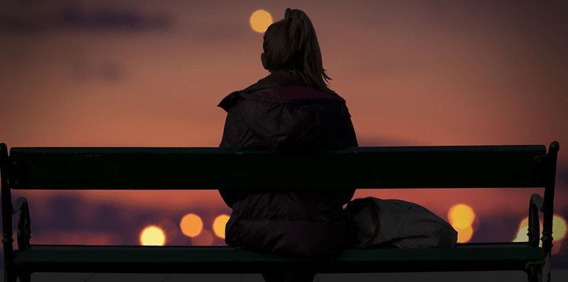 sad woman sitting on the bench