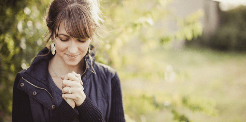 happy woman praying
