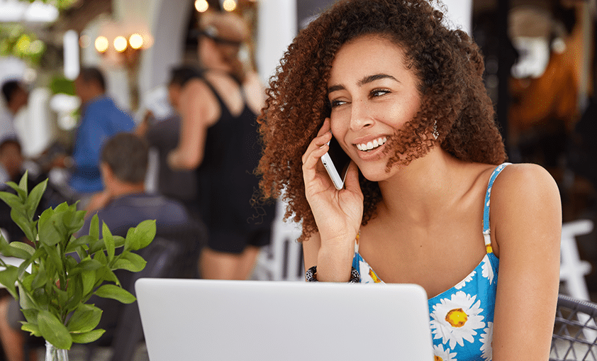 happy woman talking to someone over the phone