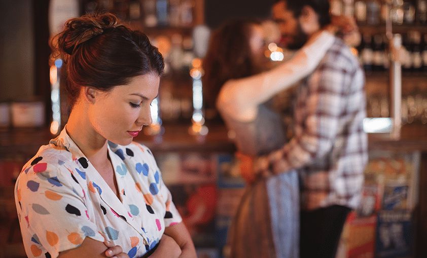 unhappy woman seeing couple